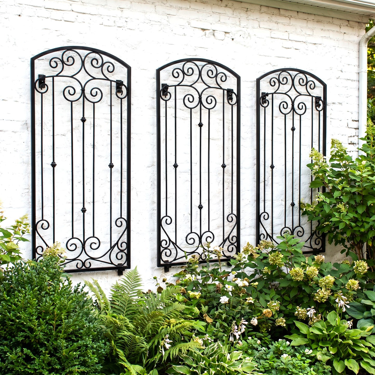H Potter Lenox Estate Wall Trellis - Set of 3 – 6 Ft Tall Iron Garden Screens - black finish on a white brick house