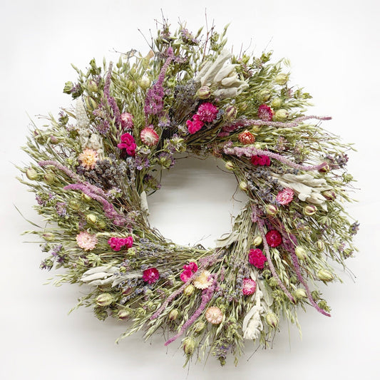 spring flower dried botanical wreath with greenery on a white background