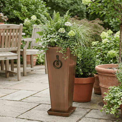 h potter garden planter on backyard patio with green plants