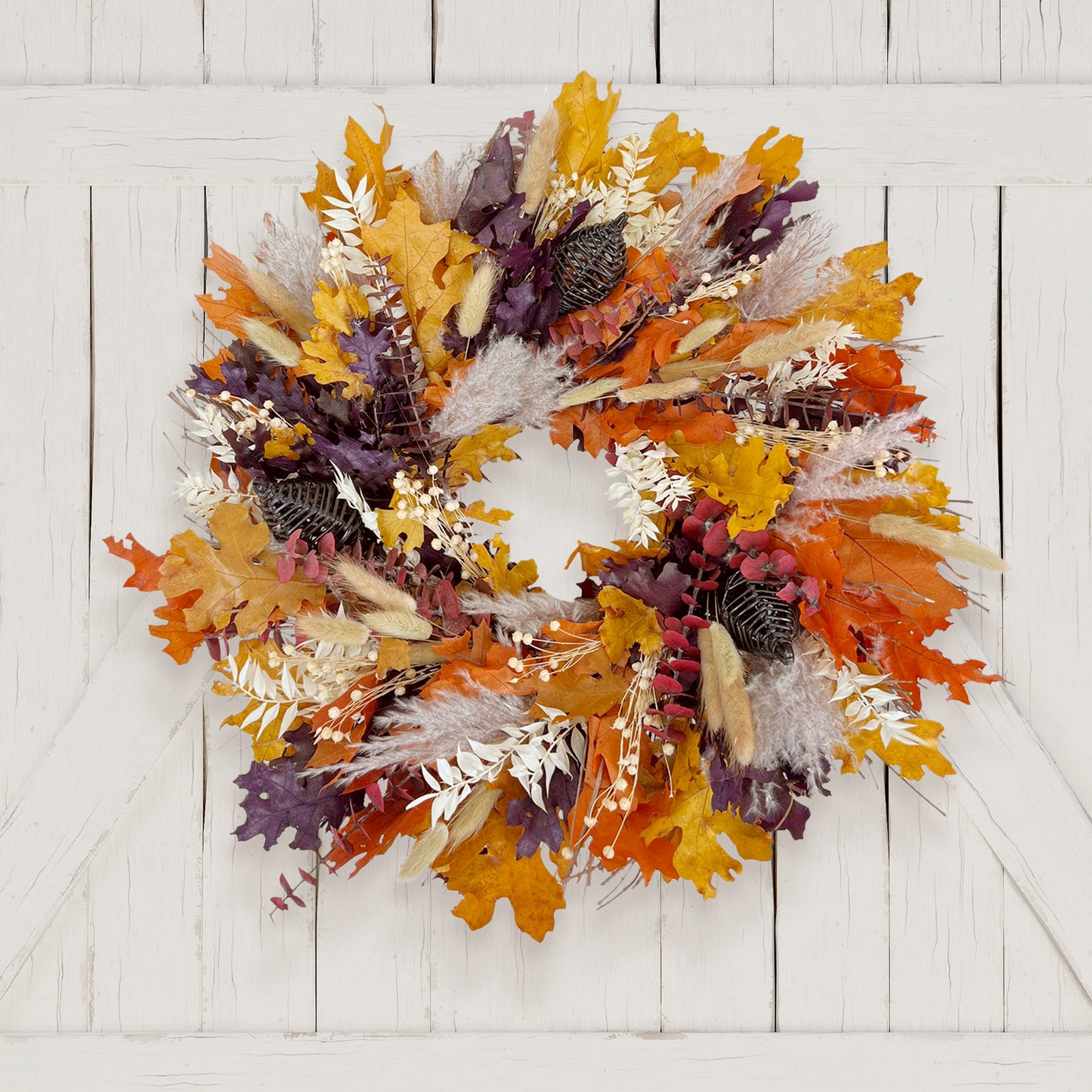 H Potter preserved autumn-themed wreath with colorful leaves on a white wooden background