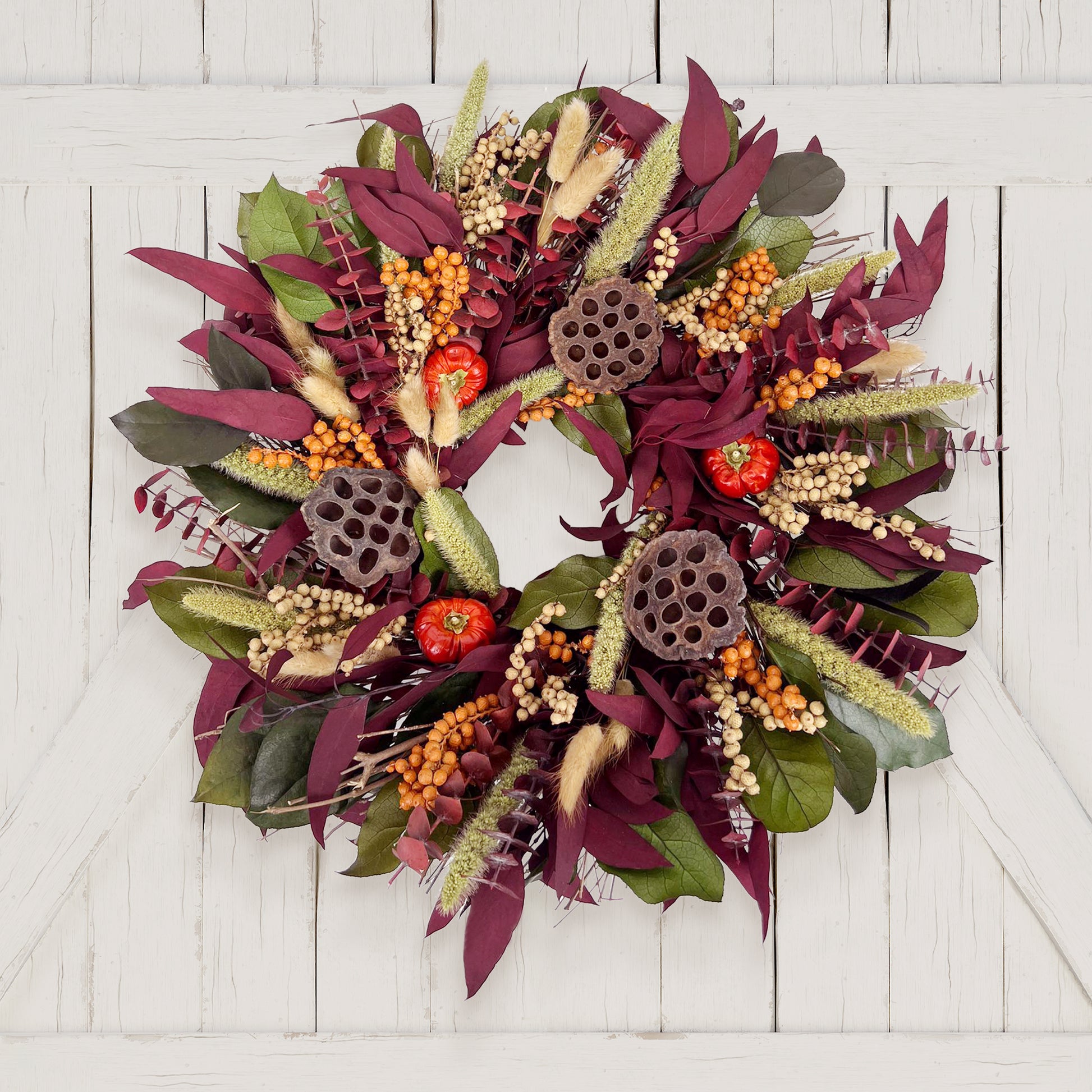 H Potter decorative wreath with autumnal elements on a white wooden background