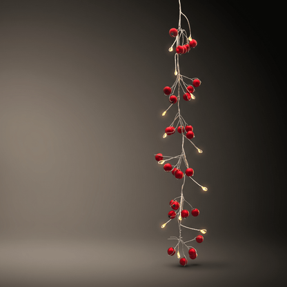 h potter vertical hanging garland of red berry-shaped string lights with small warm white bulbs on a dark gray gradient background.