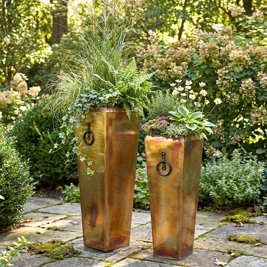 h potter santa fe tall planter set in rustic finish on stone garden patio with green plants