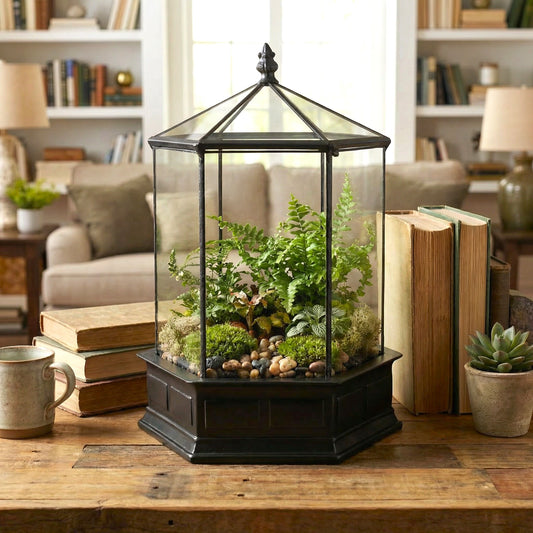 H Potter terrarium on a wooden table with books and a cup in a home setting