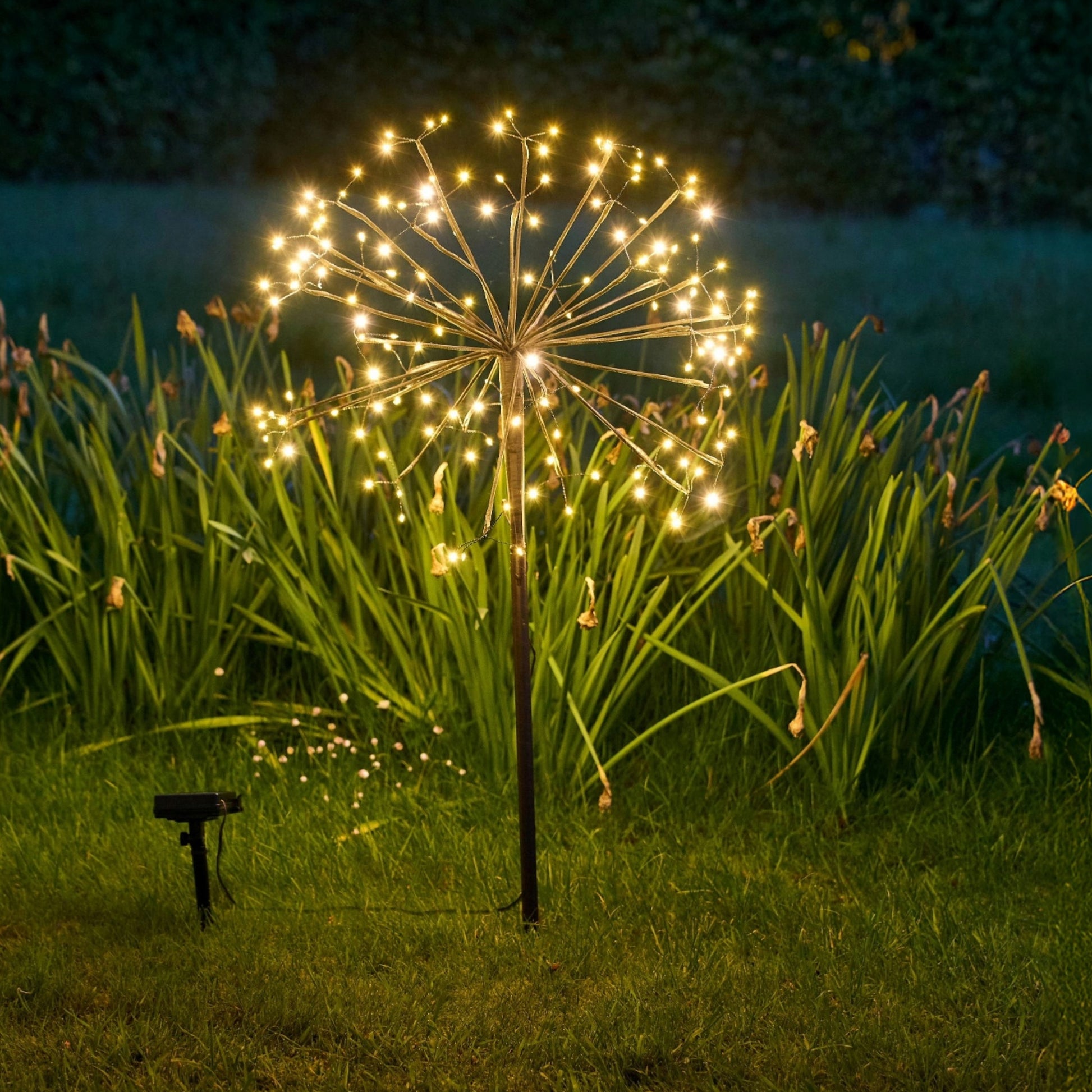 closeup of h potter solar garden light golden bloom in yard