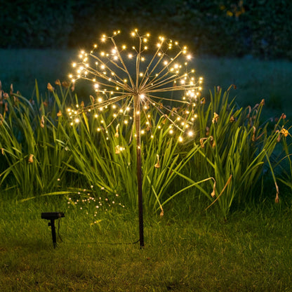 closeup of h potter solar garden light golden bloom in yard