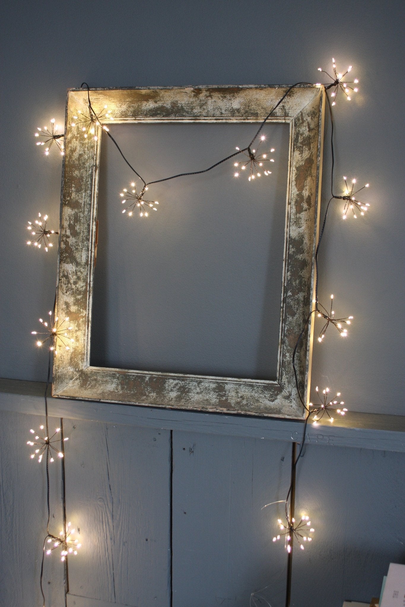 h potter sparkle light string on a wooden frame