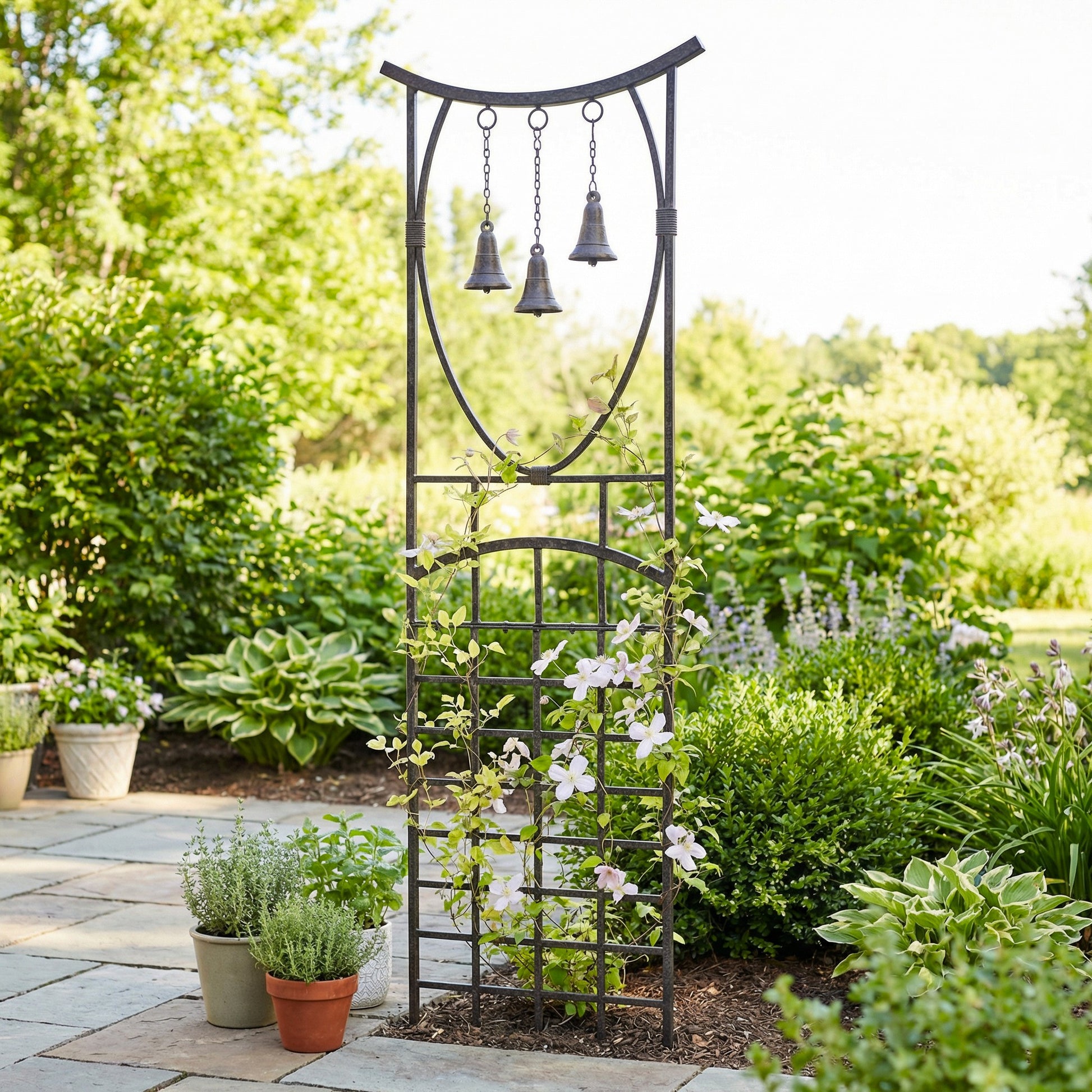 H Potter Steeple Bells Garden Trellis staked in a bed of mulch with clematis