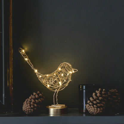 H Potter LED lit metal bird on a shelf with pine cones