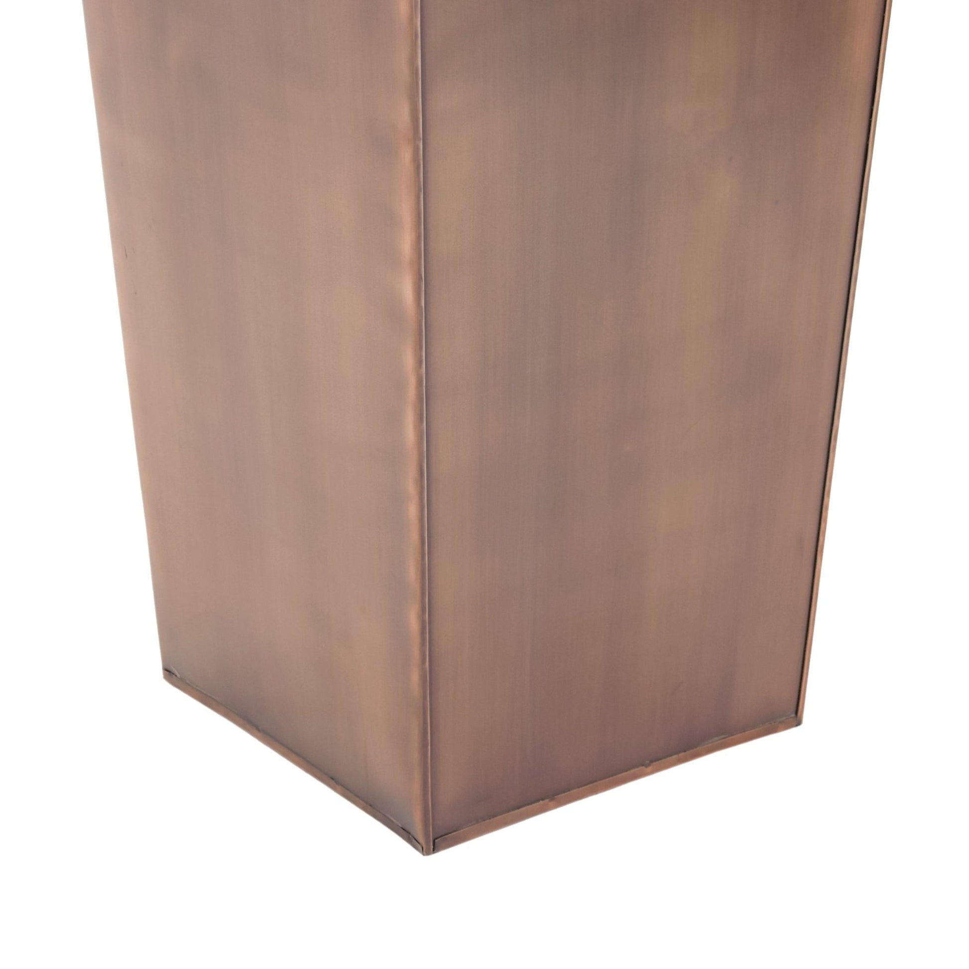 Close up of tall copper planter base