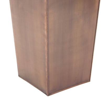 Close up of tall copper planter base