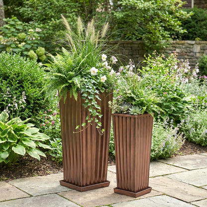 H Potter tall antique copper garden planters set of 2 on stone patio with green plants