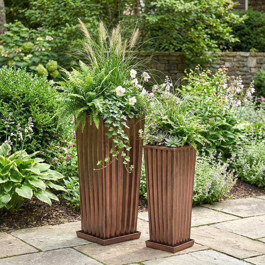 H Potter tall antique copper garden planters set of 2 on stone patio with green plants