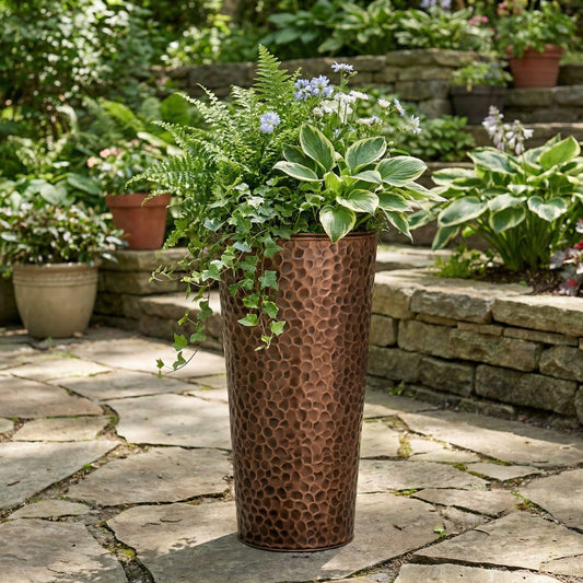 h potter tall column planter hand hammered on stone garden patio