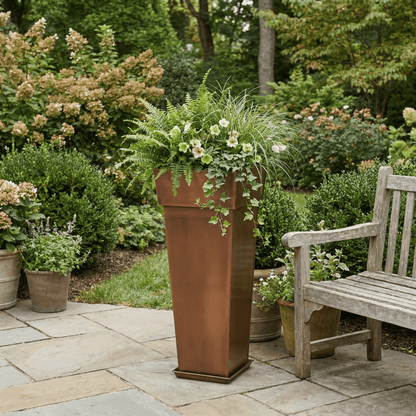 H Potter 36 inch tall garden planter on a stone patio with green plants