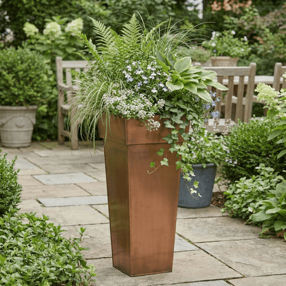 h potter planter on stone patio
