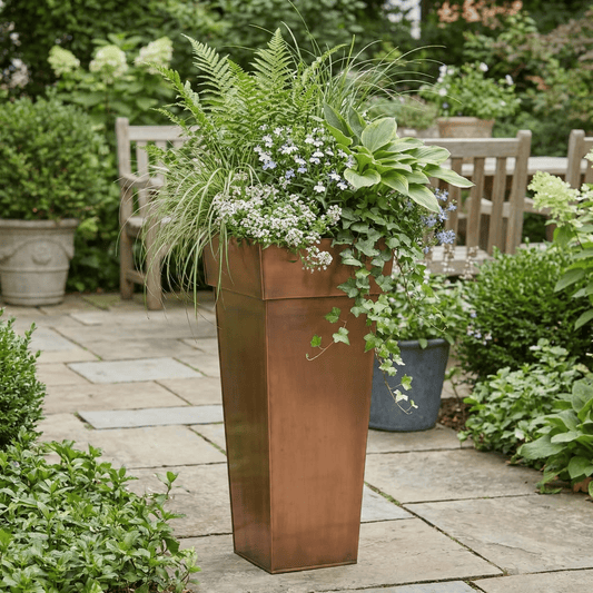 h potter planter on stone patio