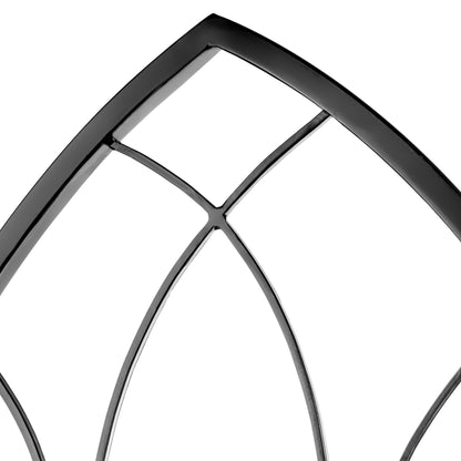 Close-up of a decorative metal window frame with geometric design on a white background