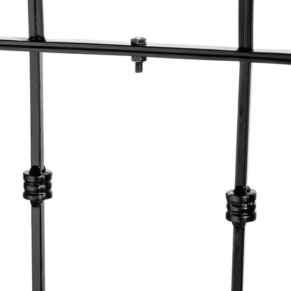 Close-up of a black metal trellis assembled on a white background