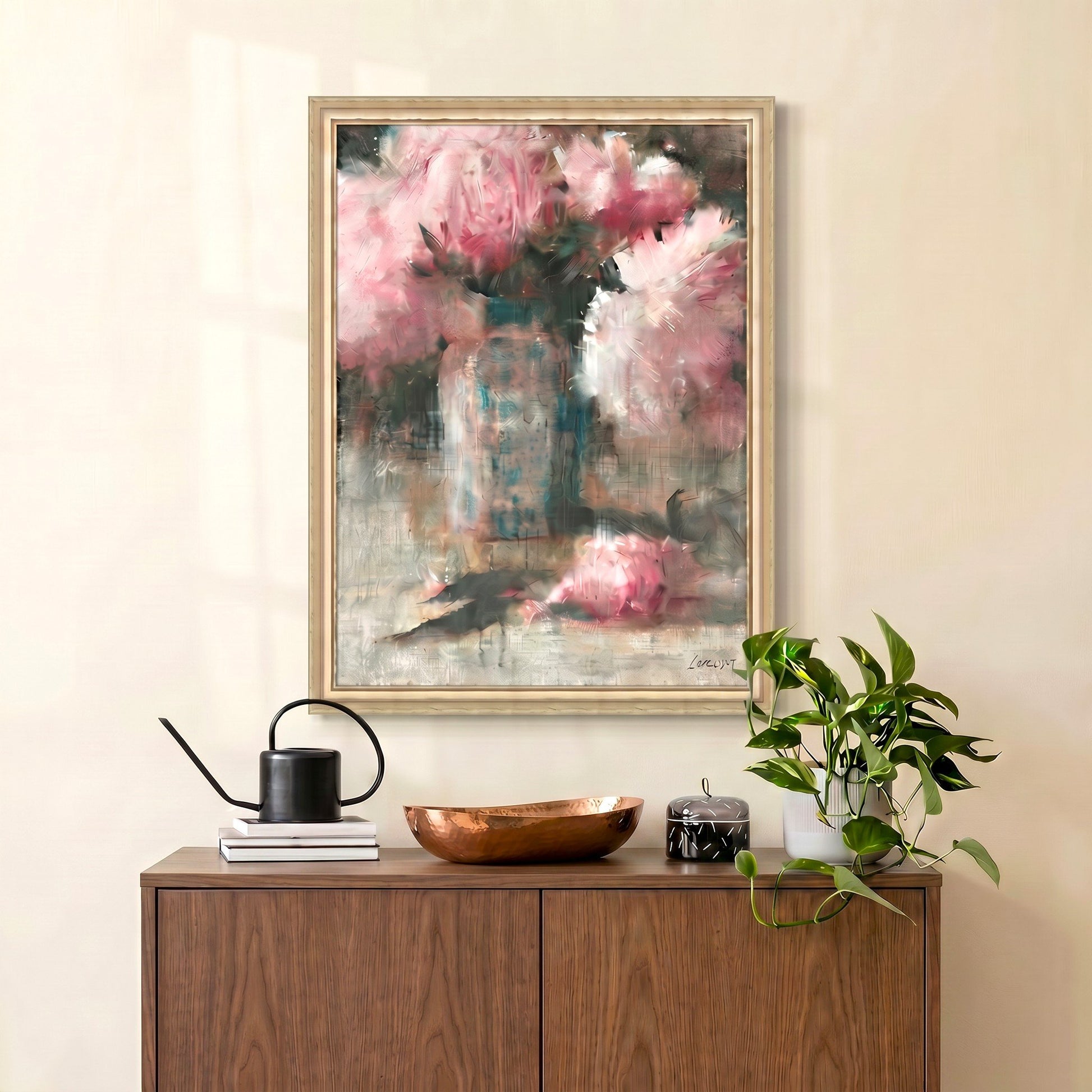 Framed abstract painting on a wall above a wooden cabinet with decorative items.