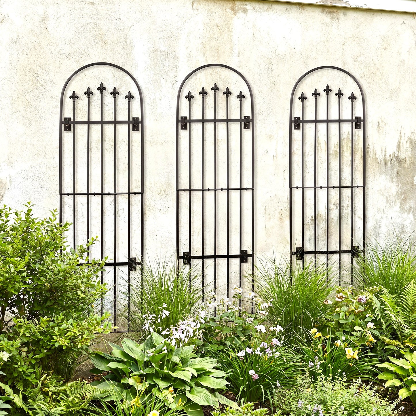 H Potter Verona Garden Wall Trellis - Set of 3 on a house with plants below