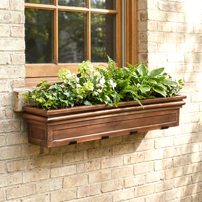 h potter williamsburg 48 inch window box in antique copper with plants on side of house