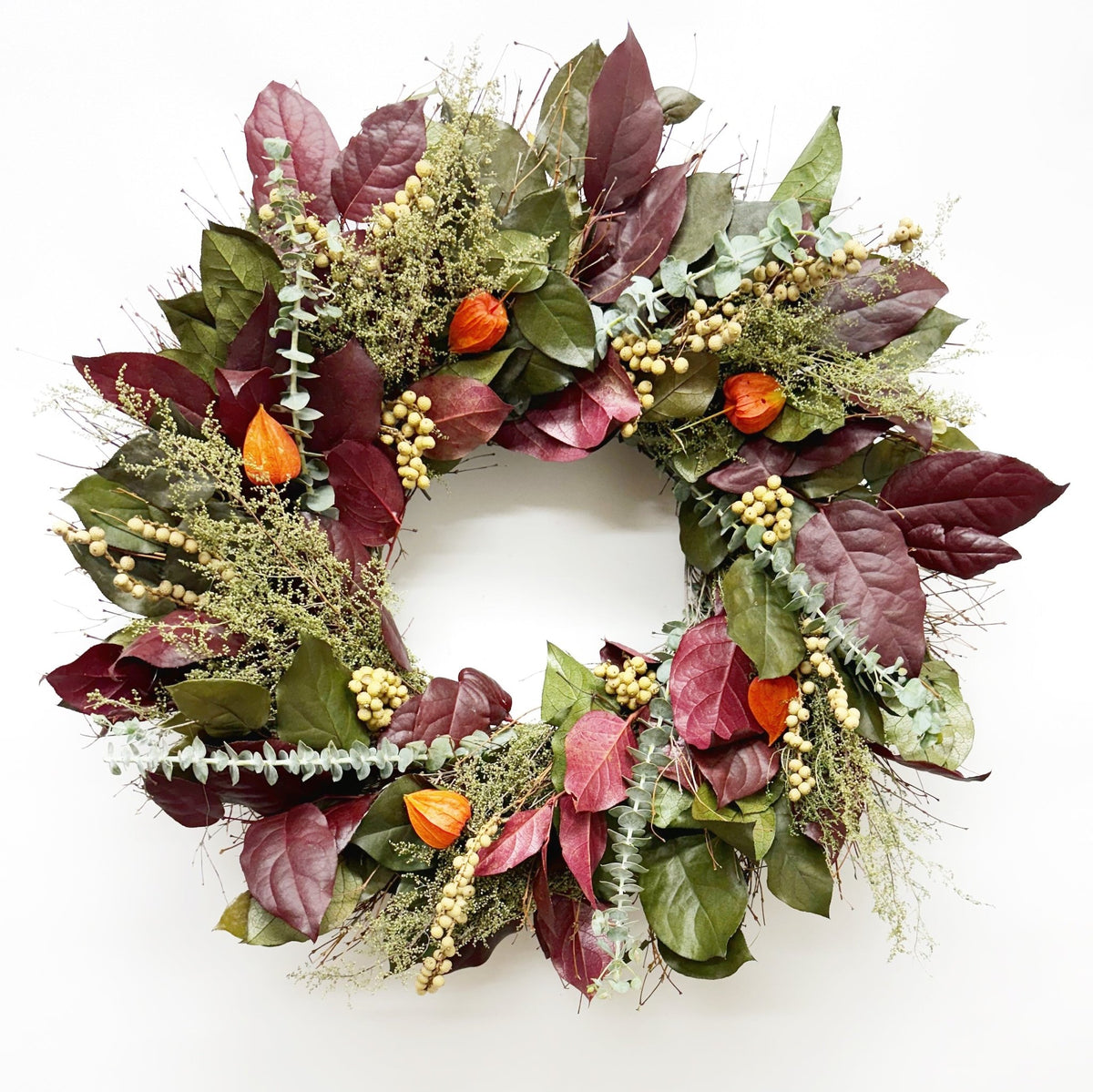 H Potter Twilight Harvest wreath—preserved burgundy salal, sweet Annie, eucalyptus, canella berries, Chinese lanterns.