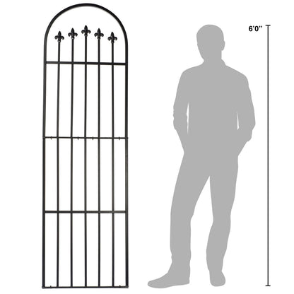 GAR525W1 trellis shown to scale beside a 6-ft person, arched wrought iron frame with fleur-de-lis tops.