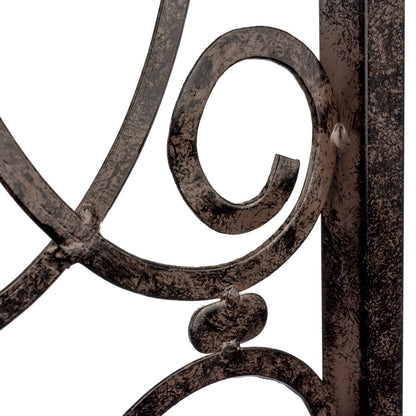 Scroll ironwork detail—handcrafted, strong for roses; tie points guide growth; low upkeep.