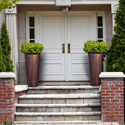 H Potter tall hammered copper planter with flowers on front porch entryway