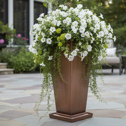 H Potter Large planter outdoors on a patio with white flowers
