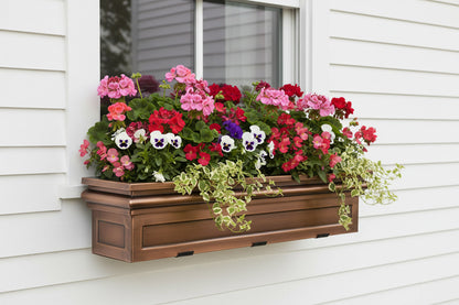 H Potter Williamsburg Window Box on a white house filled with zonal geraniums, begonias, pansies