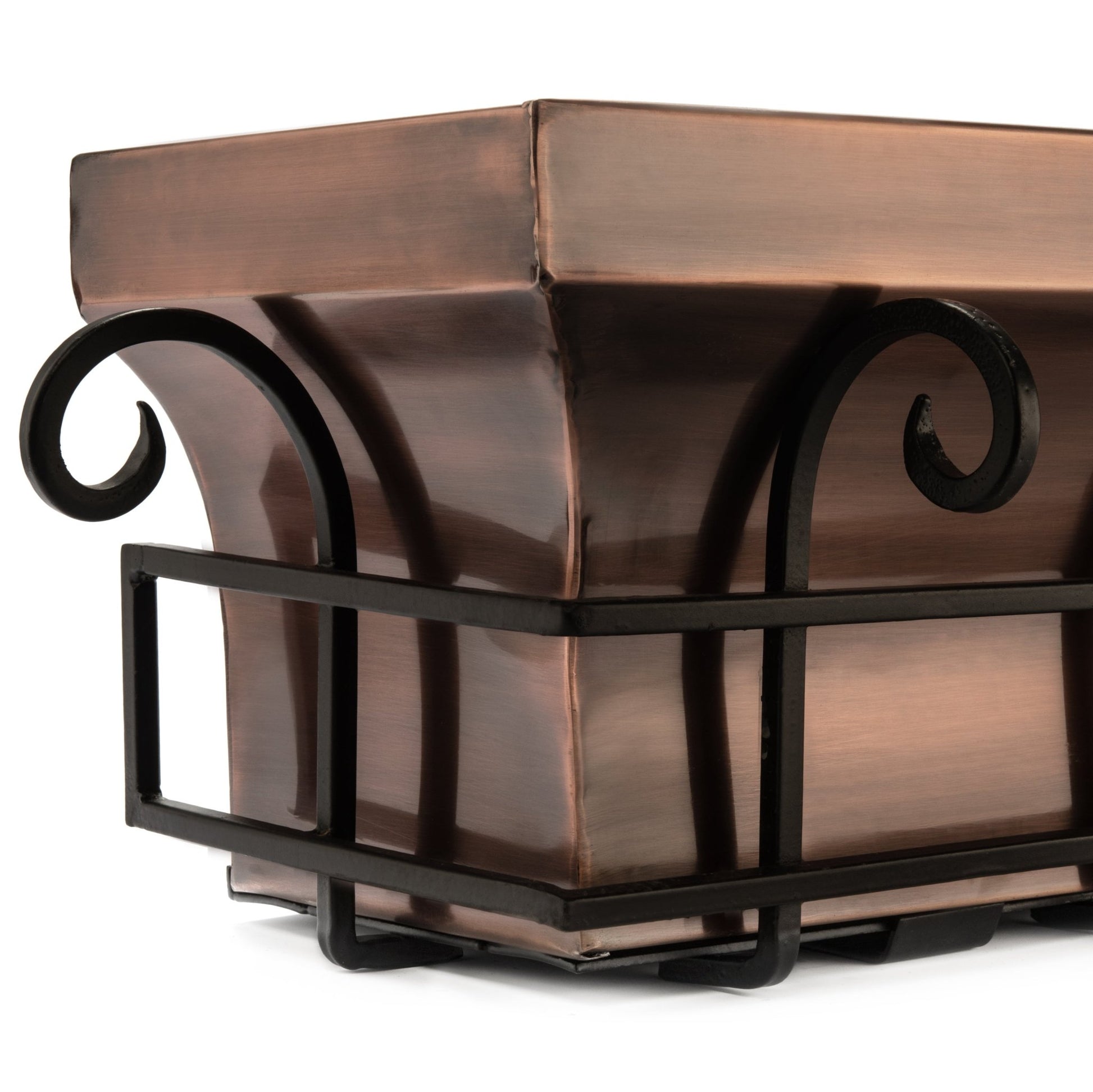 Close-up detail of H Potter scrolled iron frame and antique copper window box corner