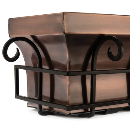 Close-up detail of H Potter scrolled iron frame and antique copper window box corner